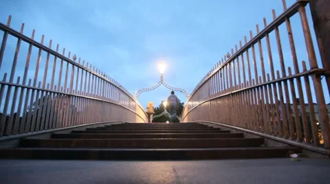 Back view of people walking on The Ha'penny Bridge in Dublin Video stock 977284