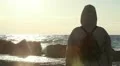 Back view of a person looking to the sea HD Footage