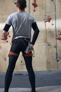 Back view of physically challenged climber taking out some chalk out of bag Stock Photos