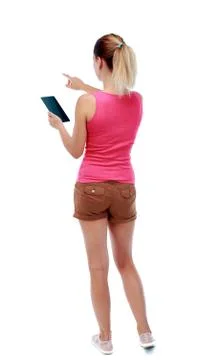 Back view of pointing young beautiful  woman and using a mobile Stock Photos