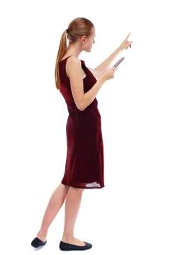 Back view of pointing young beautiful  woman and using a mobile Stock-Fotos