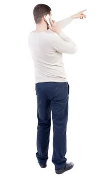 Back view of  pointing young men talking on cell phone Foto stock