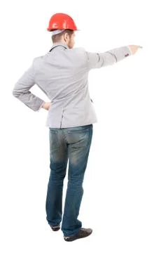 Back view of  pointing young men in helmet Stock Photos