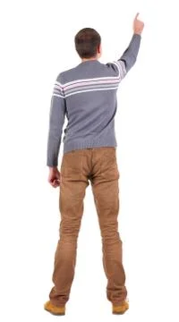 Back view of  pointing young men in  sweater and jeans Stock Photos
