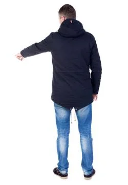Back view of  pointing young men in parka Stock-Fotos