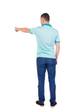 Back view of  pointing young men in  shirt and jeans Stock-Fotos