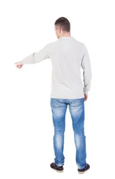 Back view of  pointing young men in  shirt and jeans Stock-Fotos