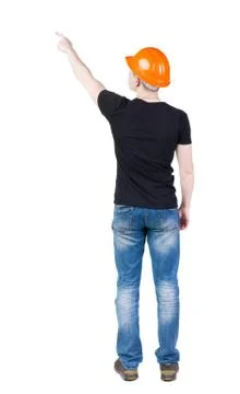 Back view of  pointing young men in  t-shirt and helmet Foto stock