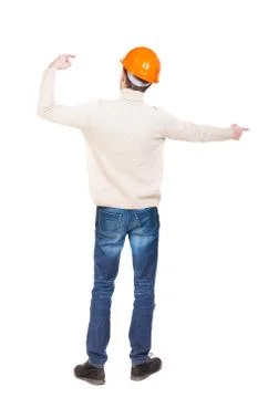 Back view of  pointing young men in helmet Stock Photos