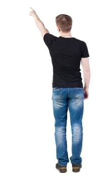 Back view of  pointing young men in  t-shirt and jeans Stock-Fotos