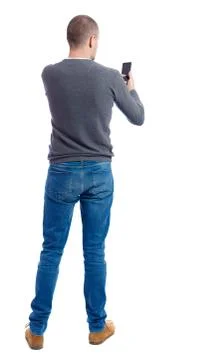 Back view of  pointing young men talking on cell phone Stock Photos