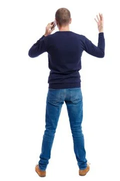 Back view of  pointing young men talking on cell phone Stock Photos