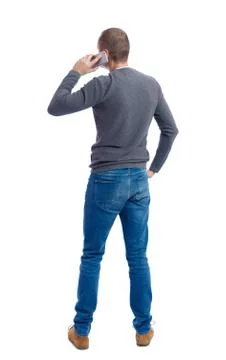 Back view of  pointing young men talking on cell phone Foto stock