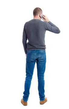 Back view of  pointing young men talking on cell phone Stock Photos