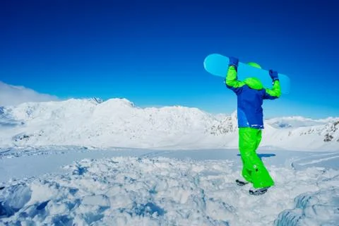 Back view portrait of a boy hold snowboard Stock Photos