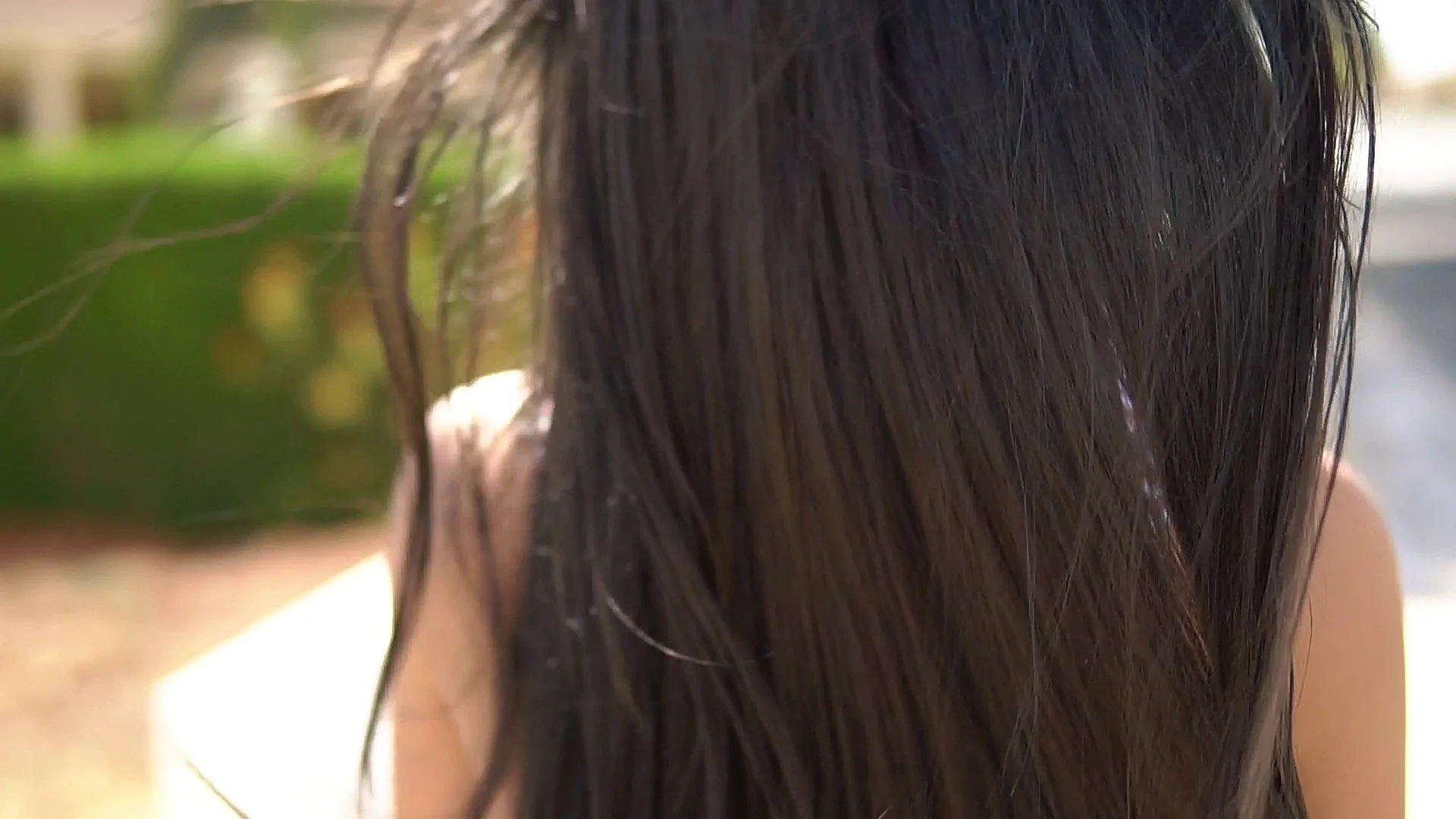 Back View Portrait Of A Girl With Long Hair Walking Down The