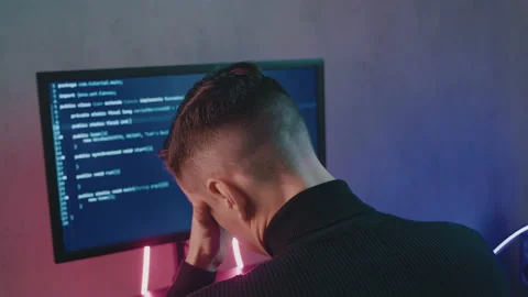 Back view portrait of tired IT professional programmer in glasses is overworking Stock-Footage 139657191