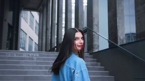 Back view portrait young beautiful brunette caucasian lady with gorgeous long Stock Footage 241606643