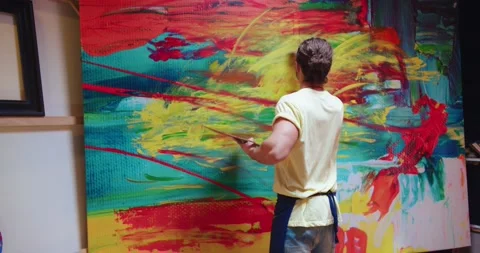 Back view. Portrait of young talented Caucasian man painter working in art Stock Footage 149584193