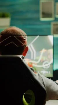 Back view of pro gamer testing new graphics of FPS videogame Stock Photos