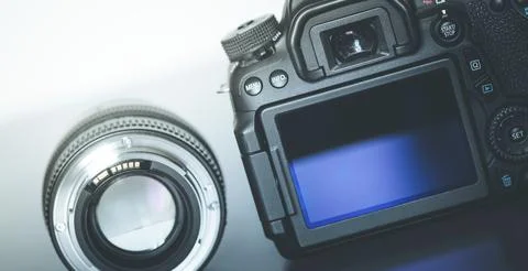 Back view of a professional reflex camera with flip lsd screen and a photo lens Stock Photos