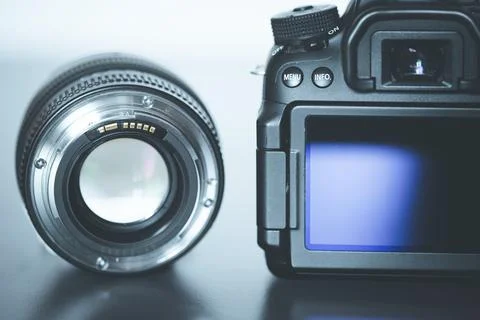 Back view of a professional reflex camera with flip lsd screen and a photo lens Stock Photos