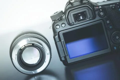 Back view of a professional reflex camera with flip lsd screen and a photo lens Stock Photos