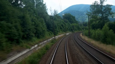 Back view of railroad train pass with beautiful green nature and mountains view Video stock 114382978