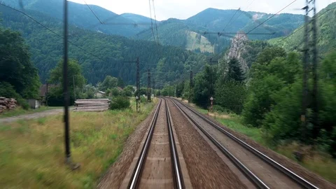 Back view of railroad train pass along countryside and railway crossing with Stock Footage 114383200