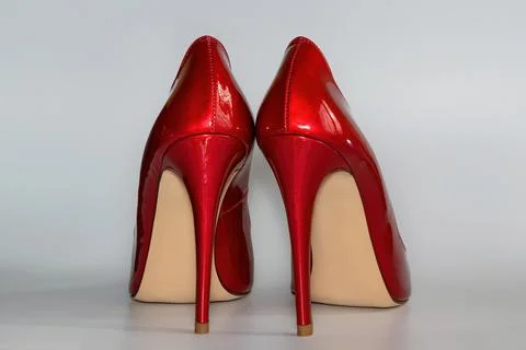 Back view of the red colored high heeled women's shoes. Stock Photos