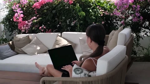 Back-view remote work in garden lounge Stock Footage 315999678