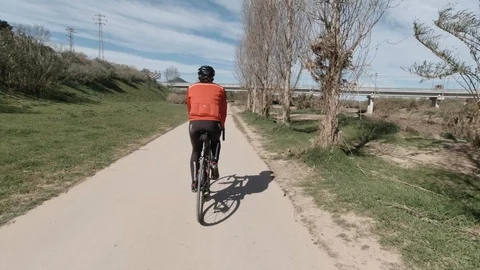 Back view of a road biker on a speeding road Stock Footage 125944345