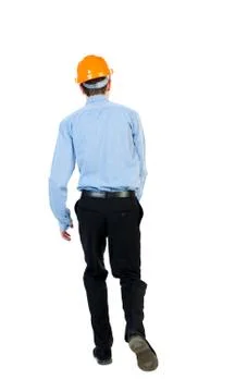 Back view of running engineer in helmet Stock Photos