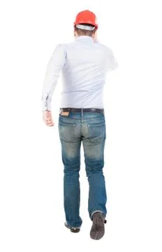 Back view of running engineer in helmet Stock Photos