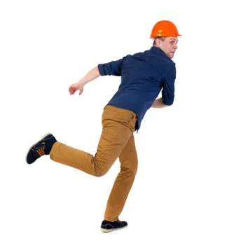 Back view of running engineer in helmet Stock Photos