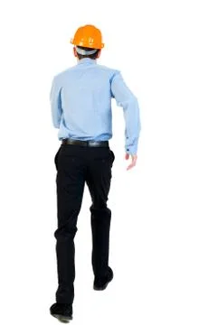 Back view of running engineer in helmet Stock Photos