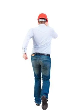 Back view of running engineer in helmet Stock Photos
