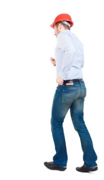 Back view of running engineer in helmet Foto stock