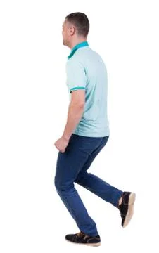 Back view of running man in blue polo Stock Photos