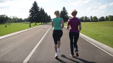 Back view of running women jogging in the park Stock Footage 76320001