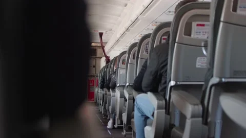 Back view of seat rows in plane. Eye angle view. Stock Footage 130398443