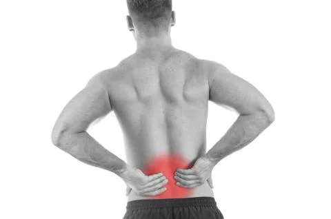 Back view of a shirtless man with lower back pain Stock Photos
