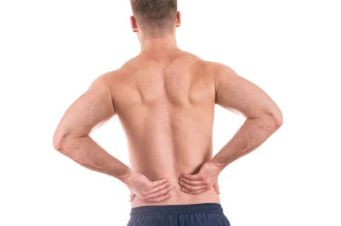 Back view of a shirtless man with lower back pain Stock Photos