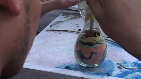 Back View Shot Of Craftsman Creating Souvenir Stock Footage 285836637