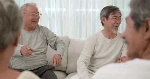 Back view shot of a Group of happy Asian seniors talking about funny story. Stock Footage 148731442