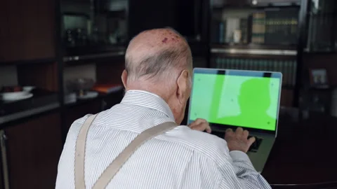 Back view shot of senior man in retirement typing on computer keyboard Stock Footage 168629650