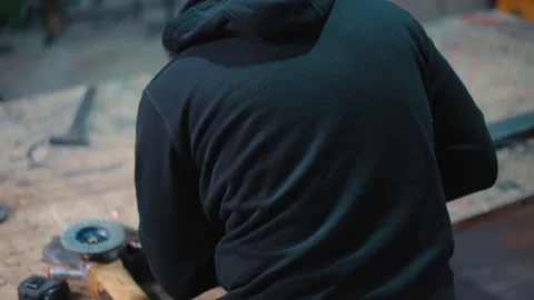 Back view shot of workman in protective uniform, gloves and welding helmet Stock-Footage 262571650