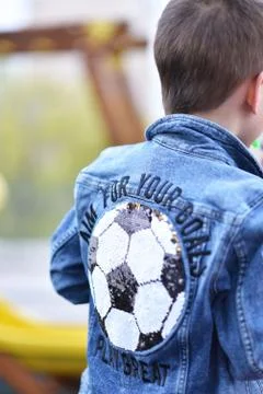 Back view of smart casual boy in blue jeans shirt looking up, black and white Stock Photos