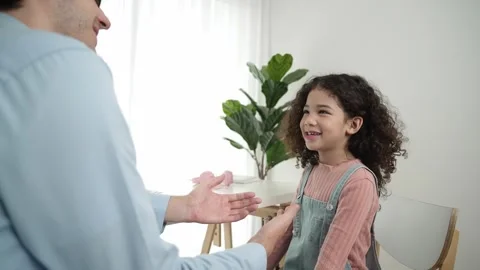 Back view of smart father explain about prompt to american schoolgirl. Pedagogy. Stock Footage 276669004