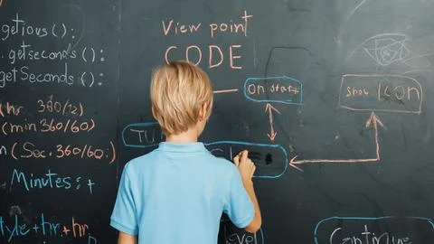 Back view of smart student writing engineering prompt on blackboard. Erudition. Foto stock